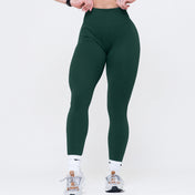 Green leggings worn by a person on a white background